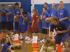 Michael Hummel with a basketball camp student